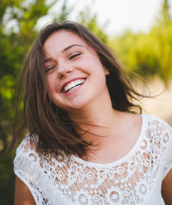 A lady smiling after having had Composite bonding treatment.